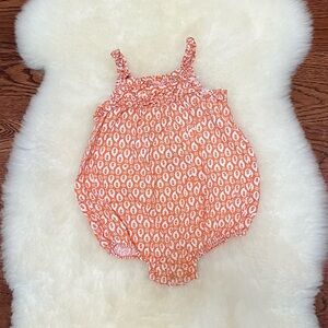 Old Navy soft orange ruffle bubble romper. 12-18.